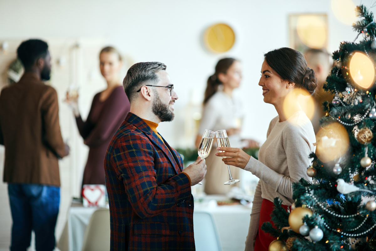 People chatting at a festive event